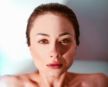 A beautiful woman is looking at the camera.