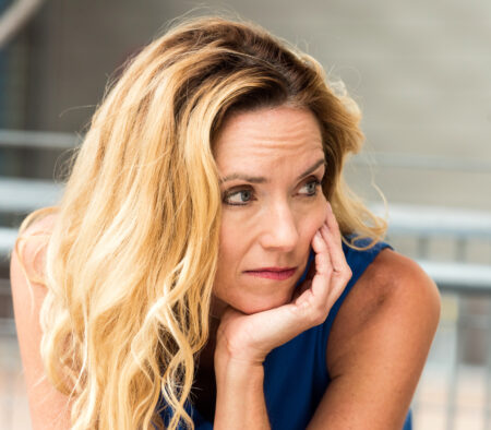 Pensive Mature Blond Woman