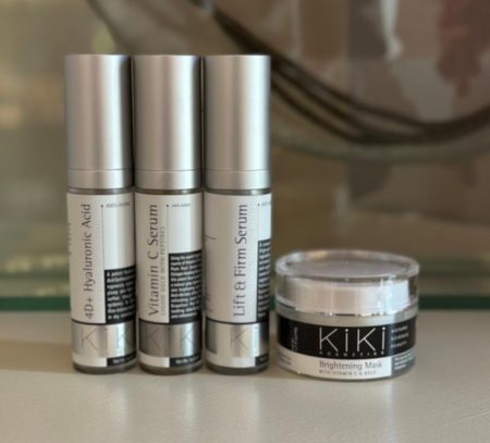KIKI skincare product line featuring hyaluronic acid, vitamin C serum, lift & firm serum, and brightening mask for professional beauty supply.